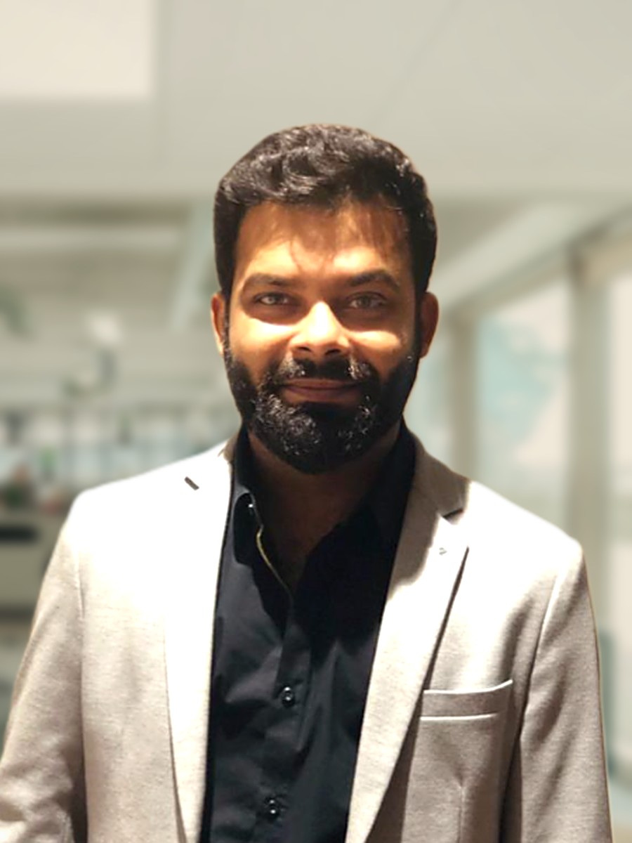 Mohit Sharma, owner of Schoolopedia, in a grey blazer in a bright office